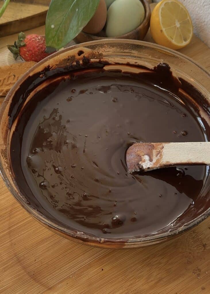 Cocoa powder, flour, and cinnamon added to melted butter and chocolate mixture for fudgy brownies