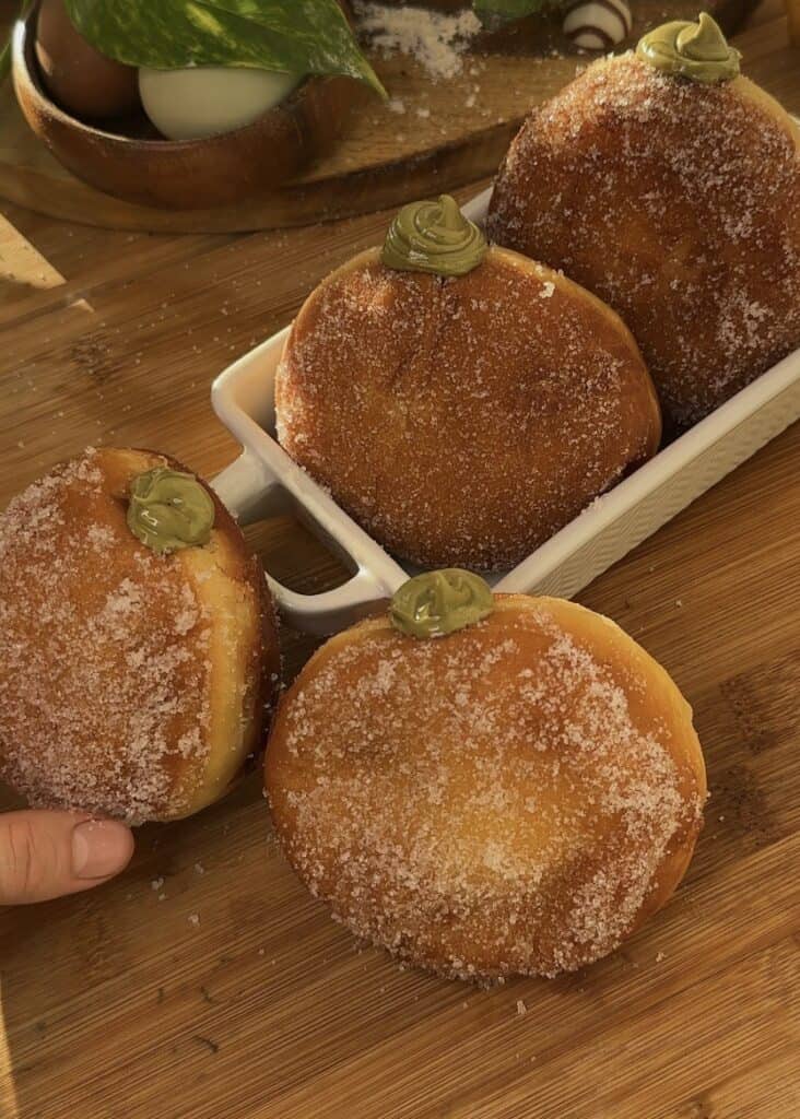 Fluffy golden Pistachio-filled donuts with oozing pistachio spread.