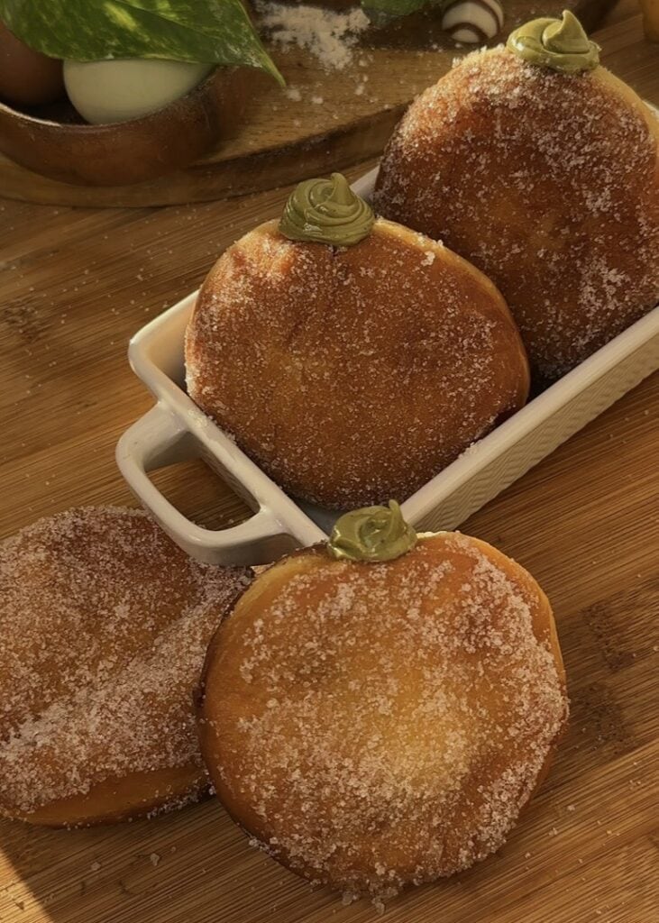 Pistachio-filled donuts with oozing pistachio spread.