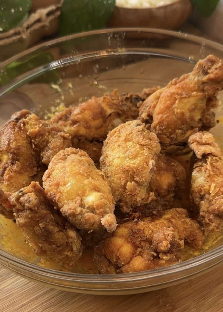 Crispy, golden-brown fried chicken wings with a juicy interior, ready to be tossed in garlic Parmesan sauce.