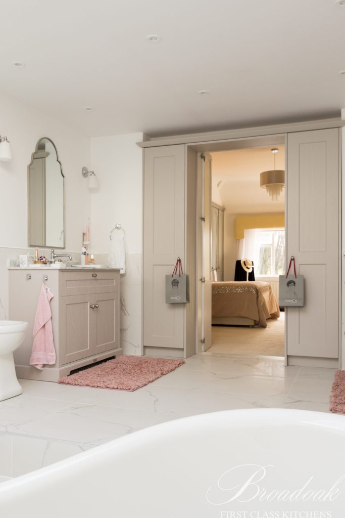 Brighten your bathroom with bespoke Broadoak Kitchens Ltd units, offering elegant storage solutions and premium finishes for a luxurious, functional space.