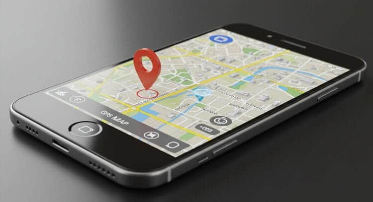 Smartphone displaying GPS tracking interface with location marker