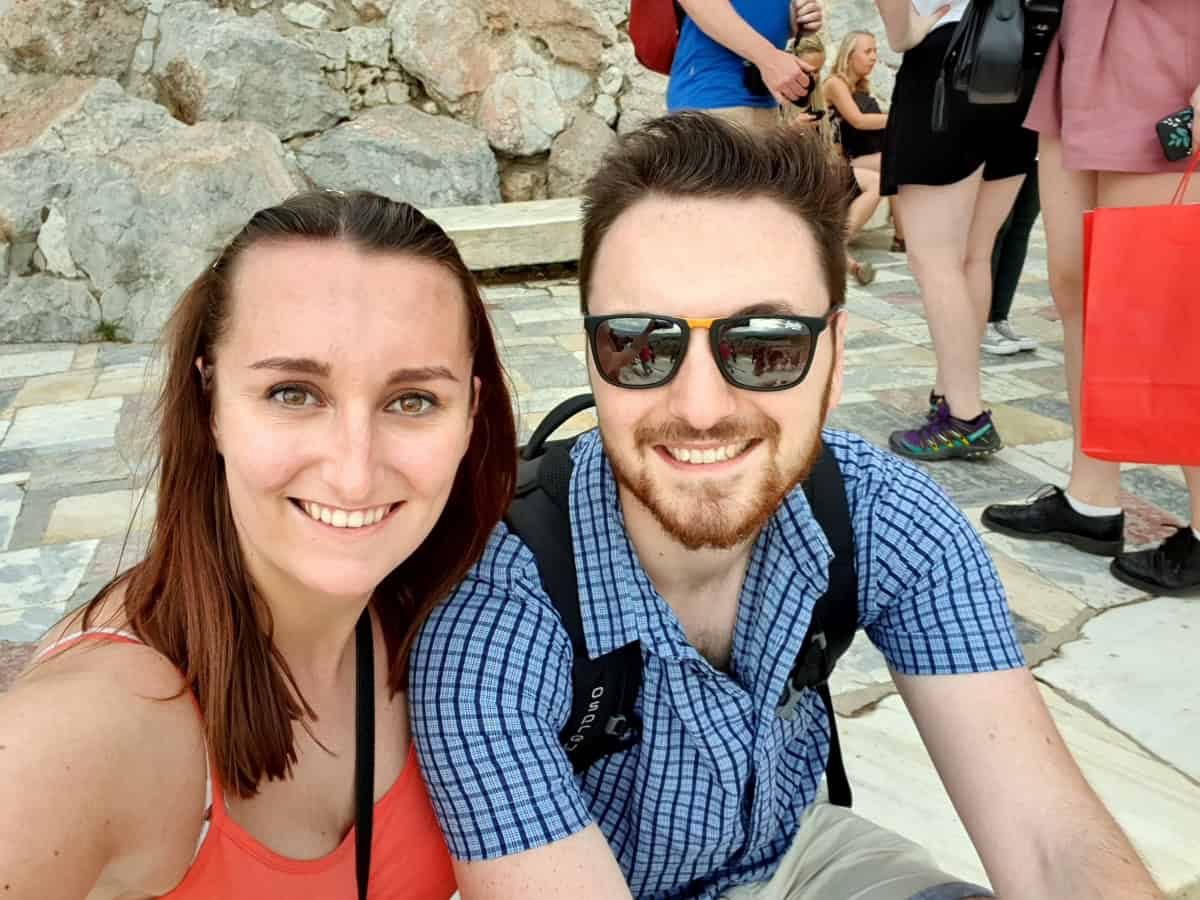 Hayden and Sophie sitting on the steps leading to the Propylaea.