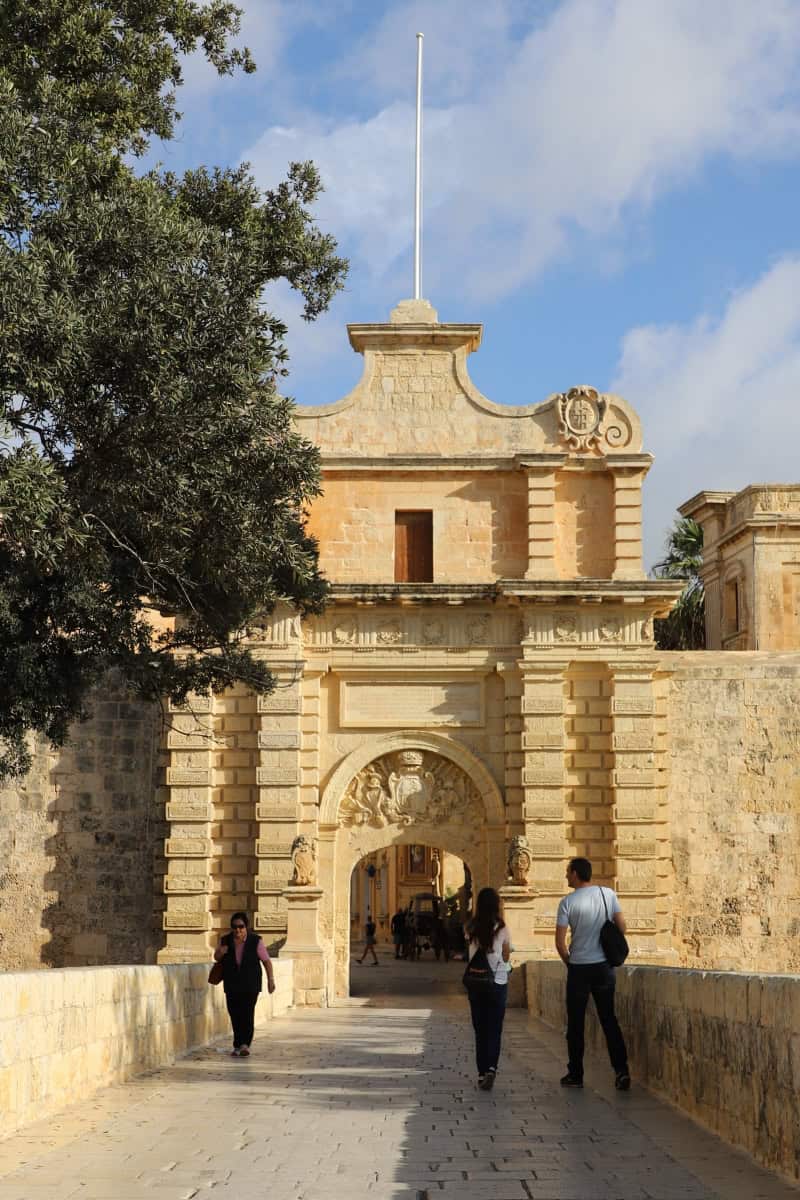 Historical city gate in Malta, iconic landmark showcasing Maltese architecture and tourism.
