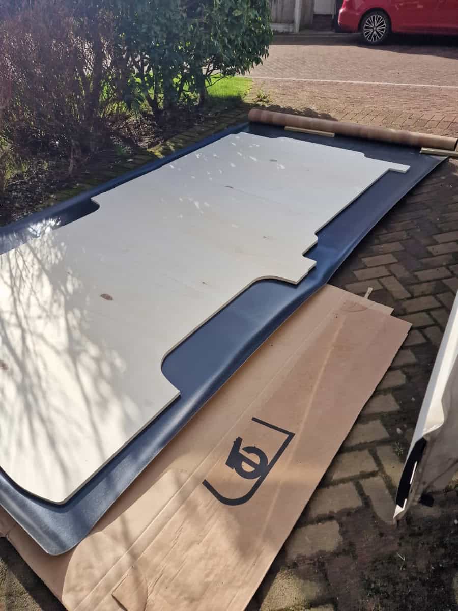 New car rear spoiler being installed - The Wandering Woodward.