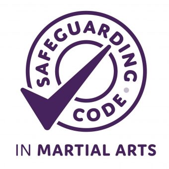 A circular logo featuring a checkmark and the text "SafeGuarding Code" for martial arts safety.