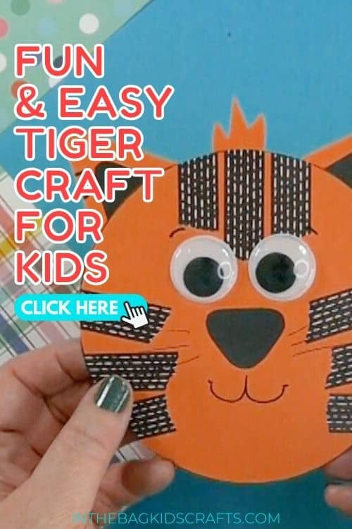 A child’s hands hold a round orange tiger made from paper and craft supplies as part of a preschool tiger craft and fine motor activity.