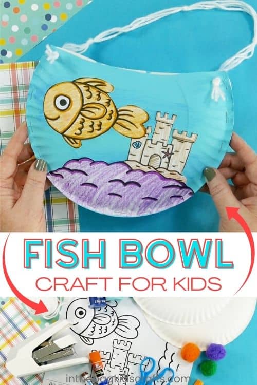 A colorful fish bowl craft for kids made from a paper plate craft, featuring a hand-colored goldfish craft swimming near a sandcastle with string handles for hanging.