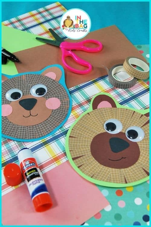 Colorful paper bear craft for kids with googly eyes, washi tape details, and crafting supplies, perfect for a fun fine motor activity.