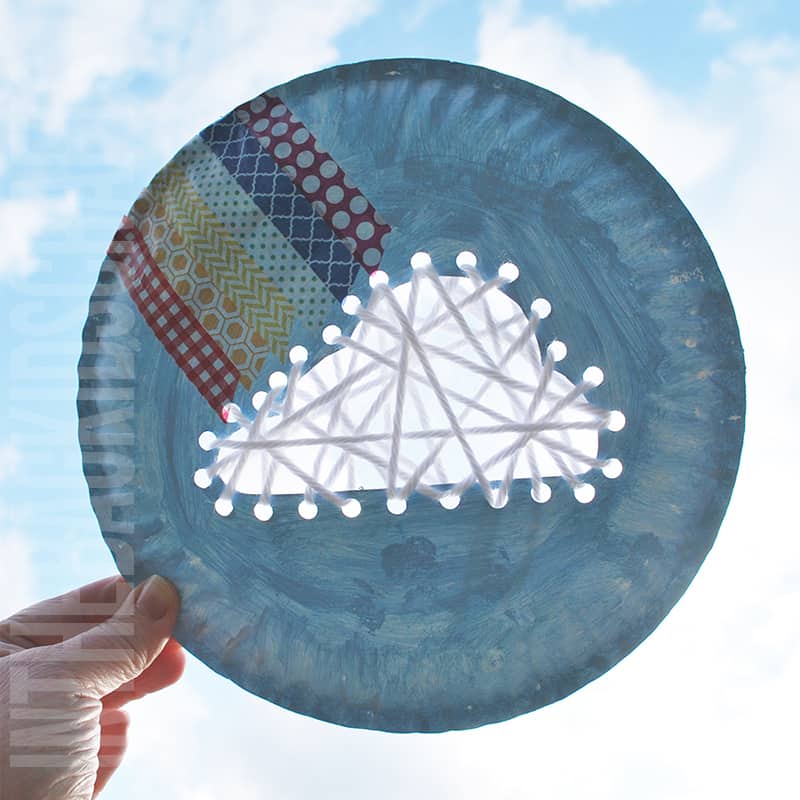 Cloud and Rainbow craft with lacing cloud cut out of paper plate and rainbow created with washi tape