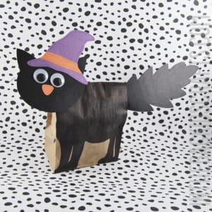 Black Cat Halloween Craft for Kids made from a paper lunch bag