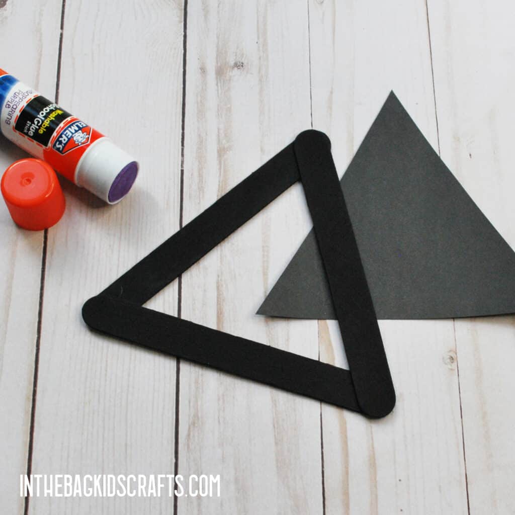 MAKE A BLACK TRIANGLE SHAPE 
