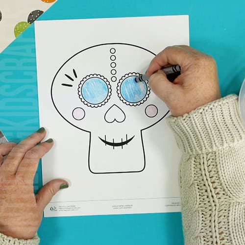 Colorful paper sugar skull craft for kids as a Day of the Dead activity, showcasing a festive and easy DIY decoration for a meaningful Day of the Dead craft.