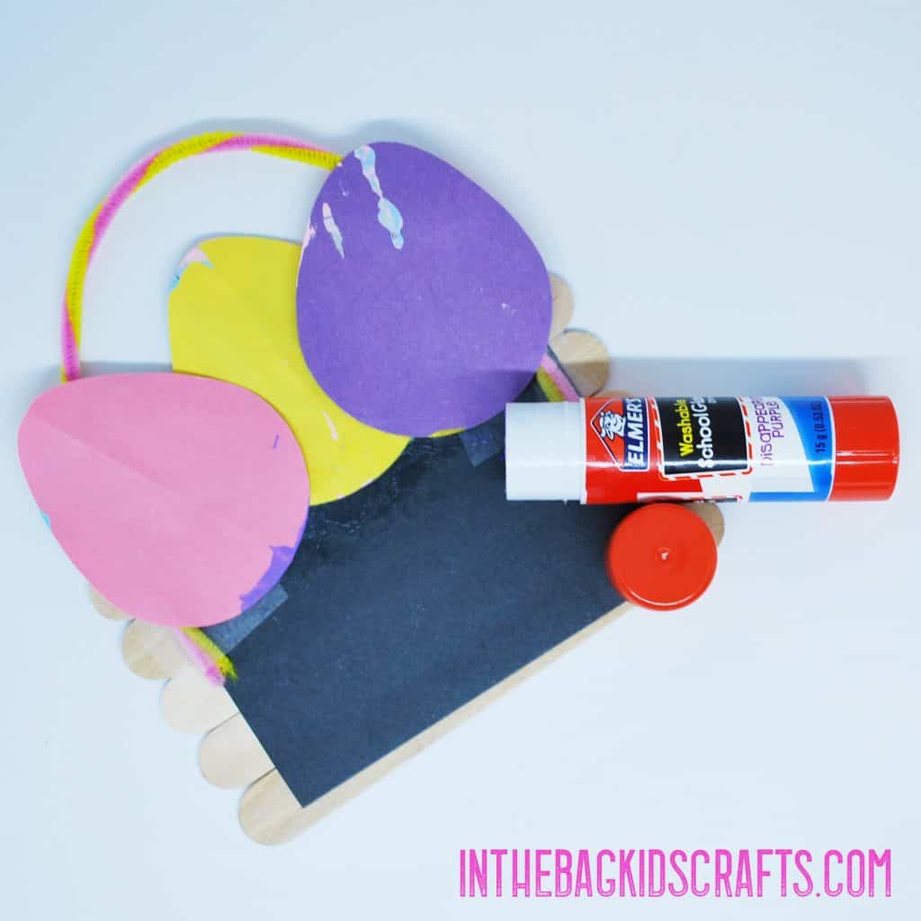 Easy Easter Basket Craft Step 5 Add the decorated paper Easter eggs 