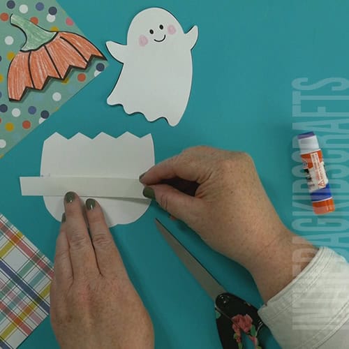 Pumpkin craft step 3 making a pocket for the ghost 