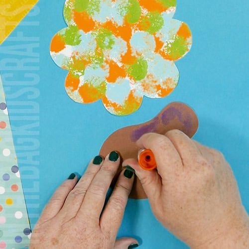Colorful turkey craft for kids featuring a free turkey outline, ideal as a Thanksgiving craft for preschool and kindergarten children.