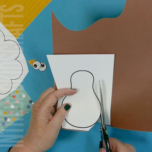 Colorful turkey craft for kids featuring a free turkey outline, ideal as a Thanksgiving craft for preschool and kindergarten children.