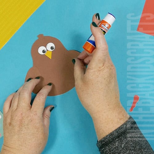 A colorful and simple turkey craft for kids featuring a cut-and-paste design, ideal for preschool craft and fall-themed Thanksgiving activities. step 2 assemble the turkey