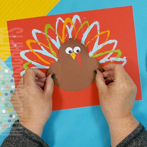 A colorful and simple turkey craft for kids featuring a cut-and-paste design, ideal for preschool craft and fall-themed Thanksgiving activities. step 6 assemble the preschool turkey craft
