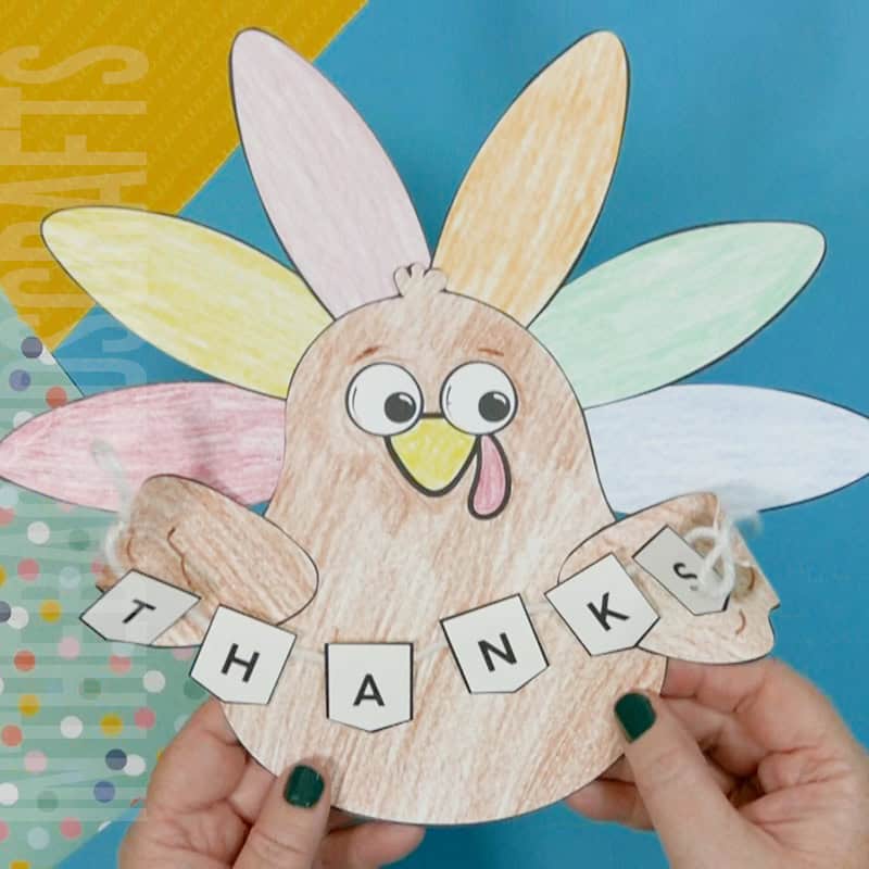 A colorful, kid-friendly turkey craft for Thanksgiving featuring a free printable template, perfect for a gratitude-themed craft for kids.