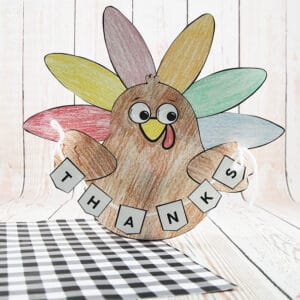 A colorful, kid-friendly turkey craft for Thanksgiving featuring a free printable template, perfect for a gratitude-themed craft for kids.