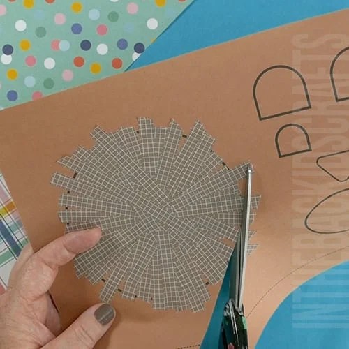Colorful paper bear craft for kids with googly eyes, washi tape details, and crafting supplies, perfect for a fun fine motor activity.  step 2