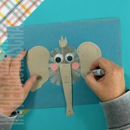An image showing an easy elephant craft for kids, perfect as an animal craft and fine motor activity. step 6