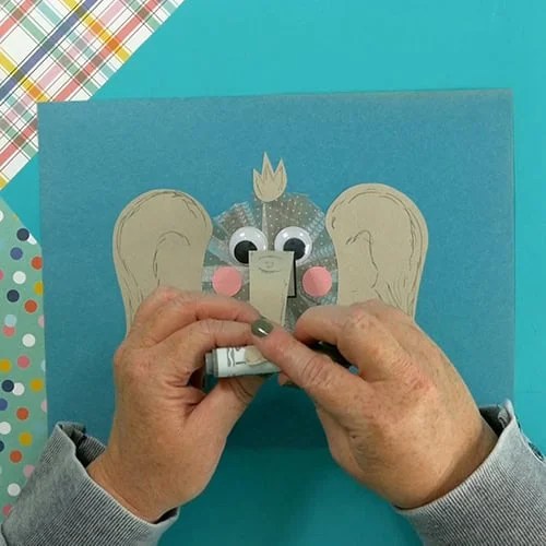 An image showing an easy elephant craft for kids, perfect as an animal craft and fine motor activity. step 6