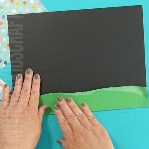 Washi tape preschool pumpkin craft step 1 tearing paper and gluing in place for grass