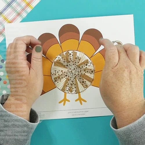 An image showing a preschool Thanksgiving turkey craft, designed as a fun and easy fine motor activity for kids. step 2