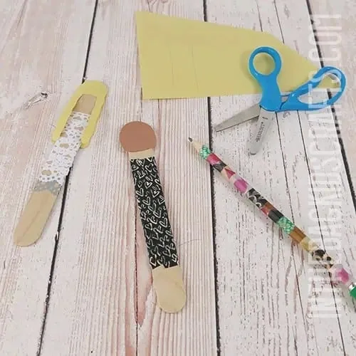WEDDING CRAFTS FOR KIDS POPSICLE STICK BRIDE AND GROOM STEP 2 ADDING CONSTRUCTION PAPER DETAILS 