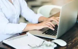 Business professional working on a laptop for cloud solutions with Microsoft Azure.