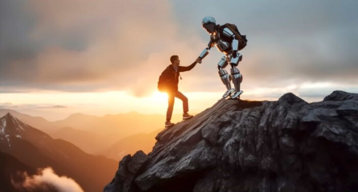 Human and robot collaborating on a mountain peak at sunset.