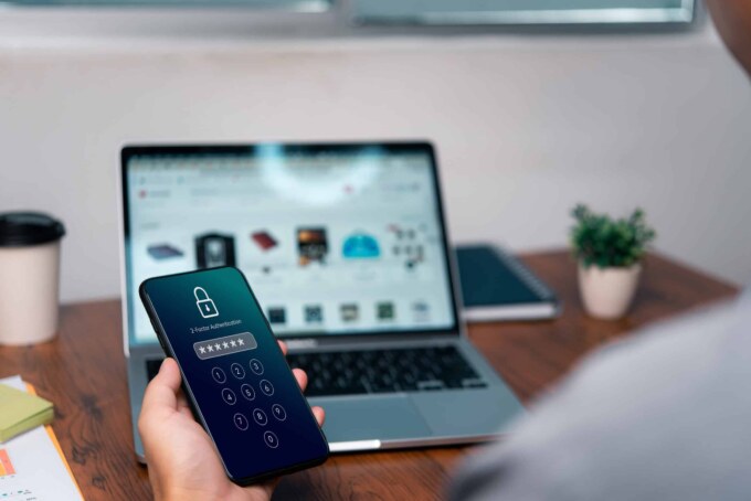 Person using smartphone with lock screen, emphasizing identity access management.