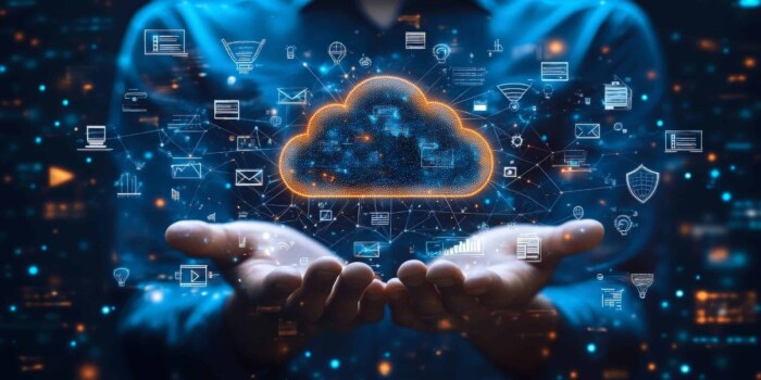 Cloud computing and data security concepts with hands holding digital cloud image.