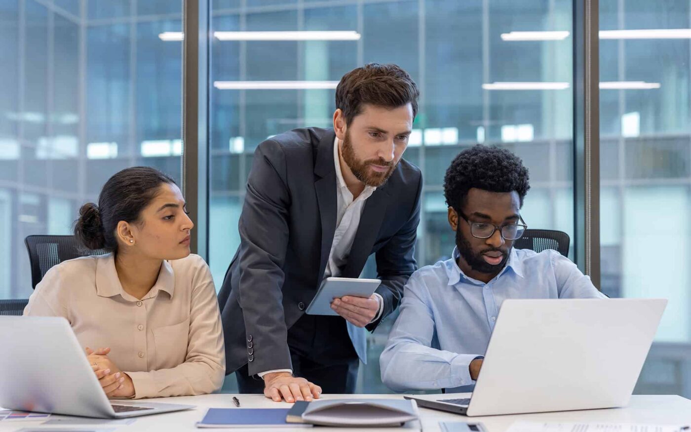 Business team comparing SharePoint and Excel for data management solutions.