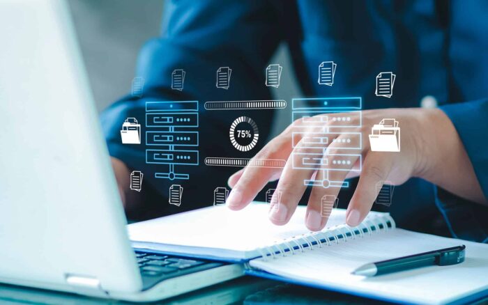Digital data transfer and workflow automation concept with a person using a laptop.