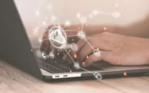 Modern cloud computing and data management technology on a laptop.