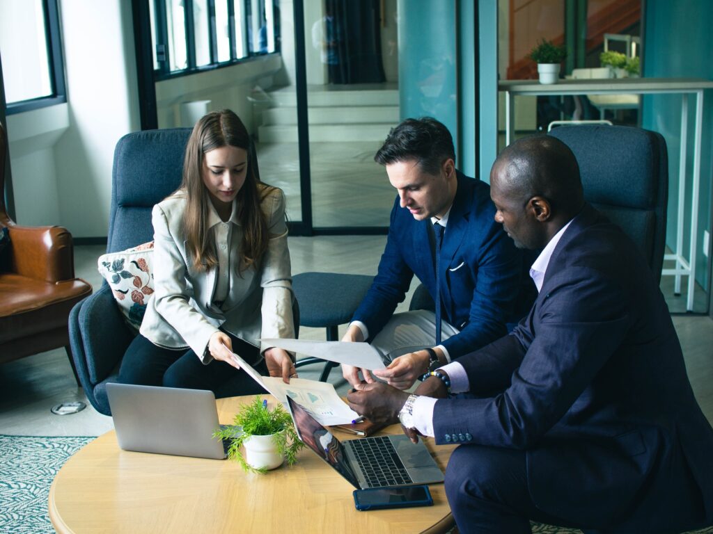 Businesswoman and businessman manager executive person company african office startup group sitting