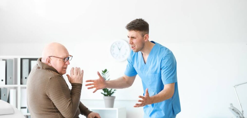 Elderly man getting yelled at by nursing home staff