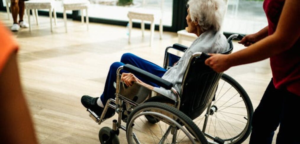 Elderly woman in a wheelchair in a nursing home