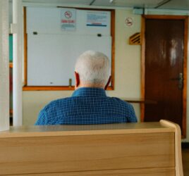 Nrusing home abuse vs neglect elderly man sits alone