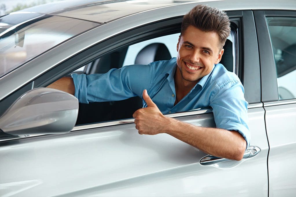 man inside car