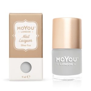 Gouden nagellak van MoYou London in een fles en doos, perfect voor elegante nagelkleuren.