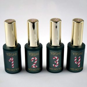 Yoshi nagellak set met vier flesjes in zwart en goud, kerstthema met candy cane design. Perfect voor.