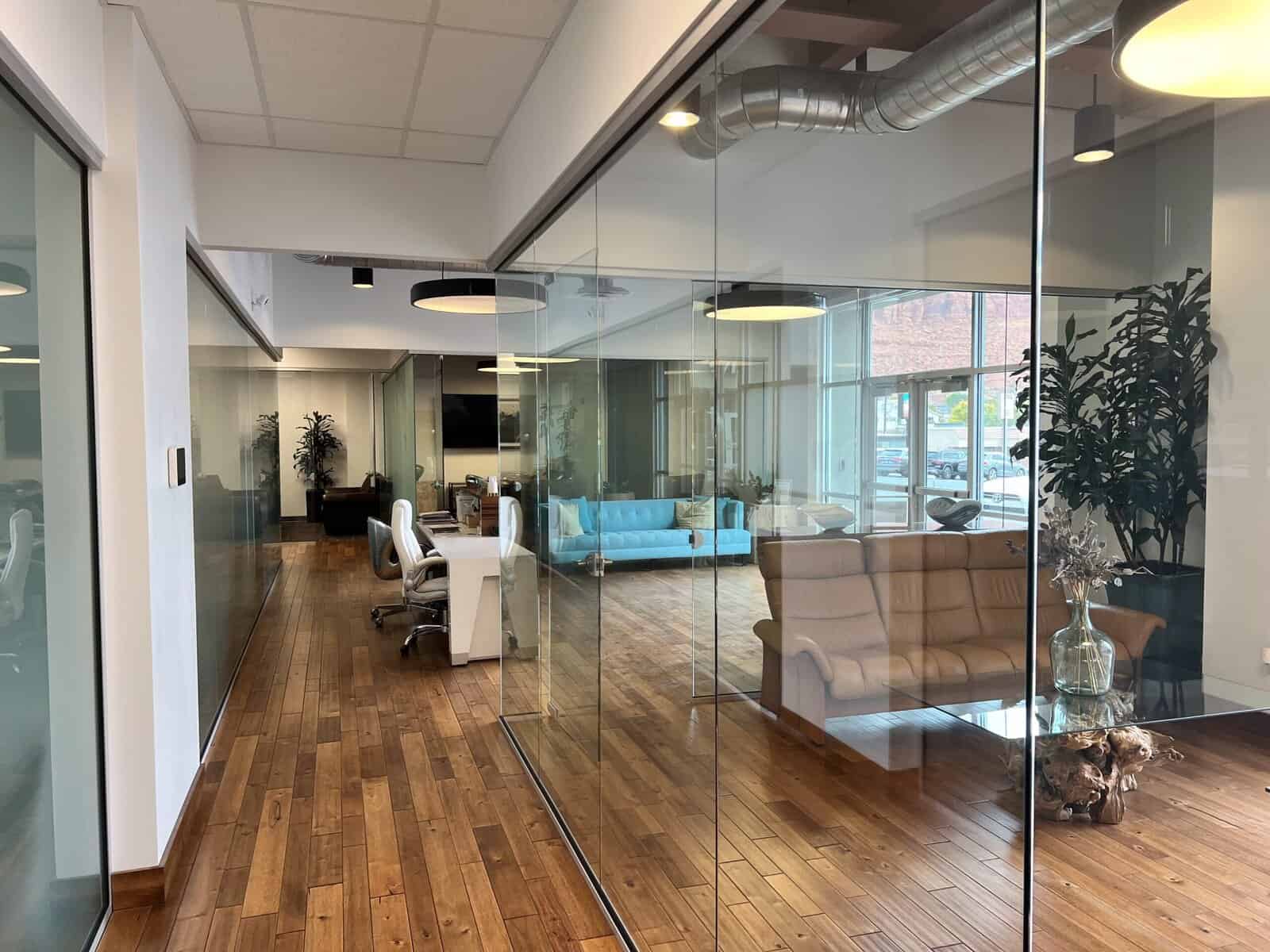 Modern medical clinic interior with glass walls, reception area, and seating in St. George, Utah.