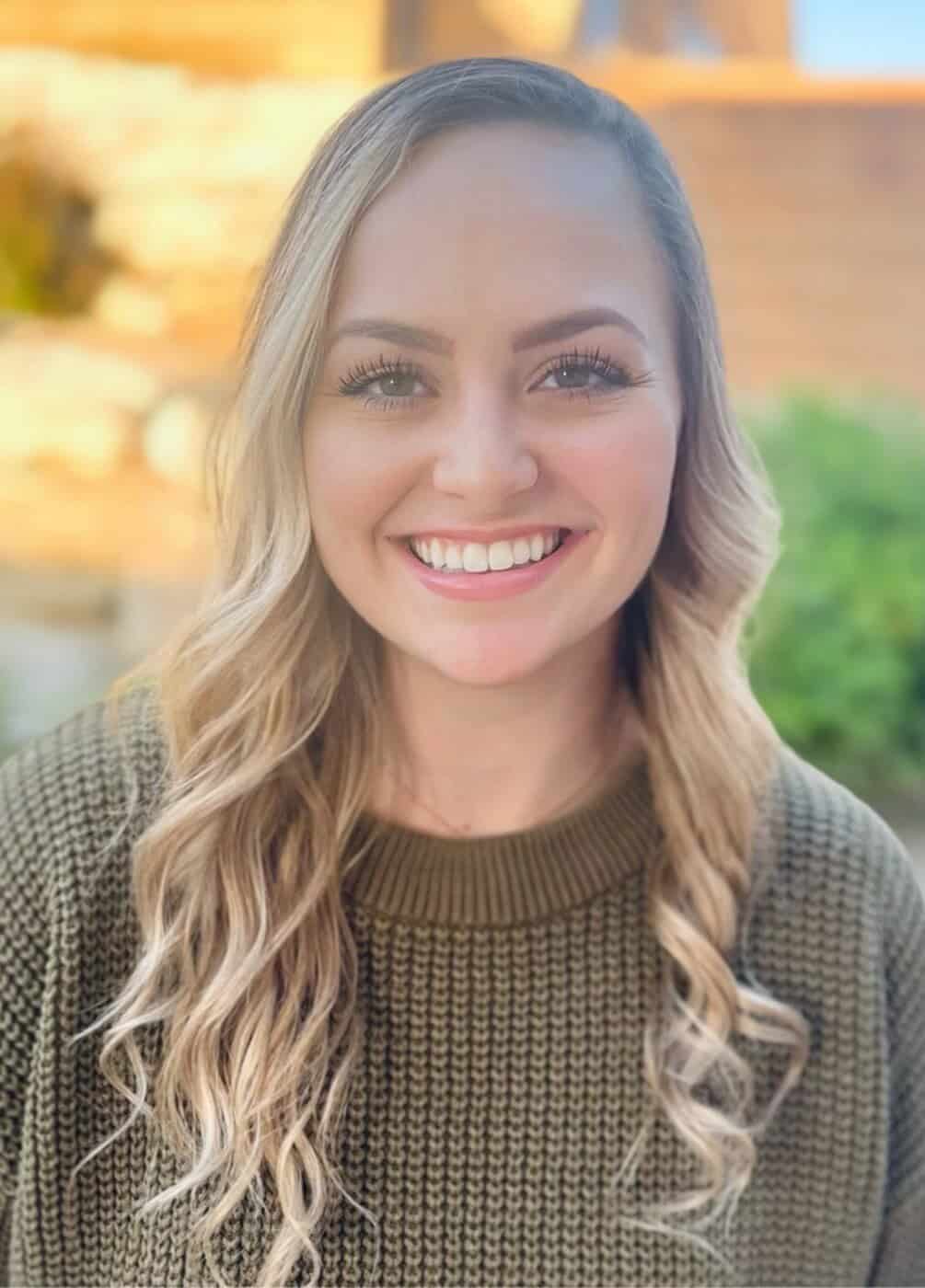 Healthy smiling woman outdoors, promoting regenerative health services in St. George, Utah.