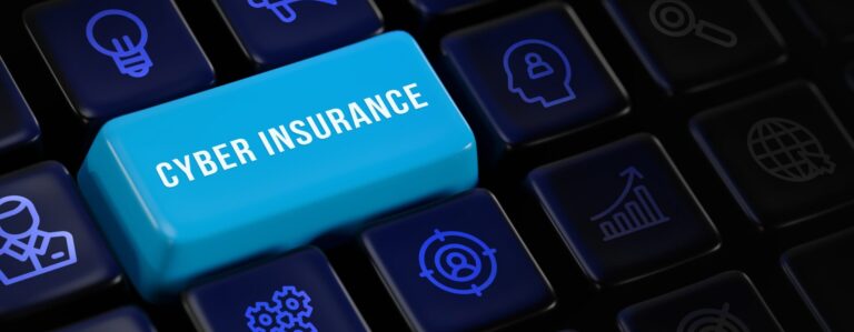 Cyber insurance key on keyboard with security icons.