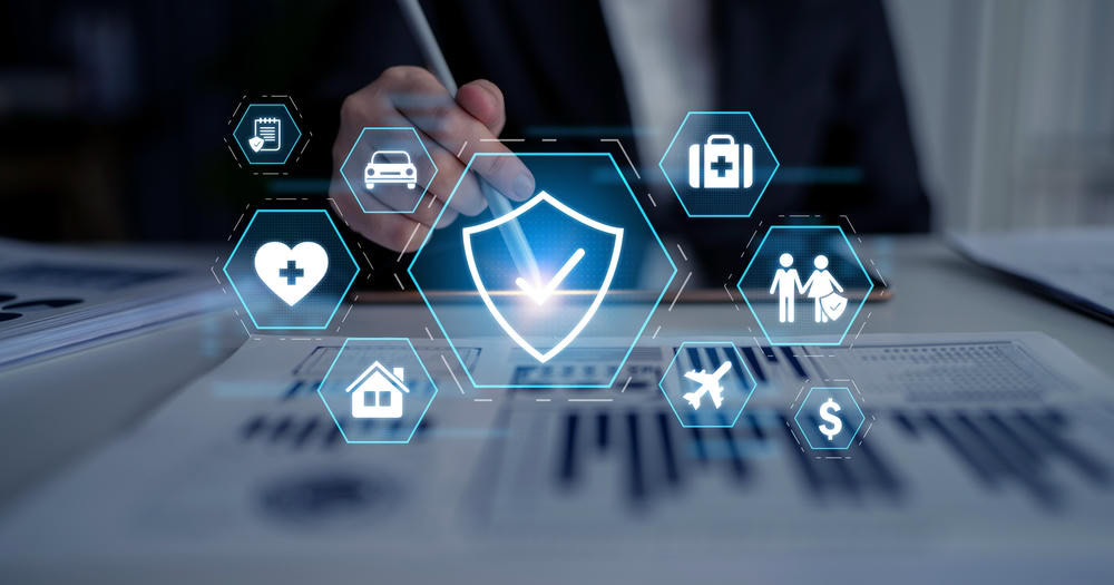 Digital insurance protection icons with shield and health symbols.