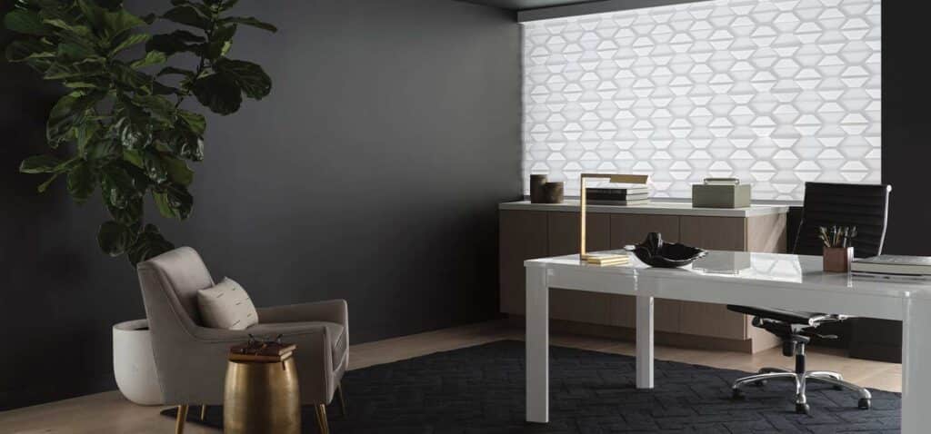 A contemporary office environment with a white desk, ergonomic black chair, beige lounge chair, and decorative accents, perfect for productive work and stylish interior design.